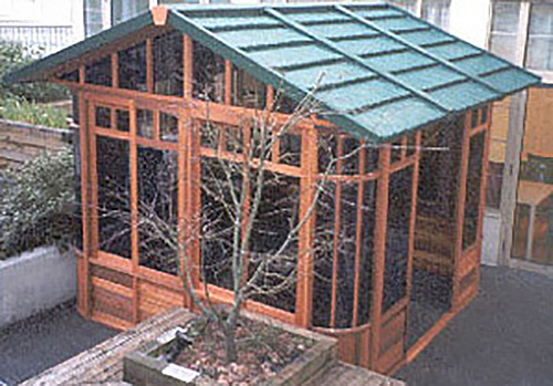 a gazebo with green roof